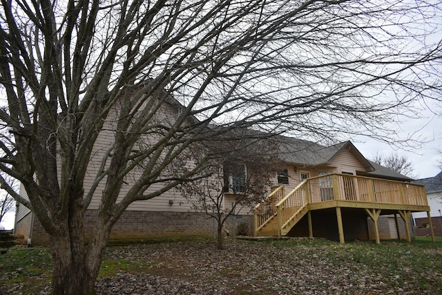 rear view of house featuring a deck