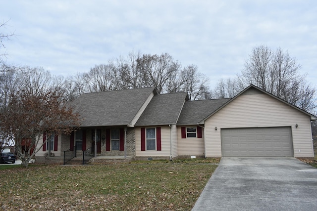 view of front of house with a front yard, a porch, and a garage