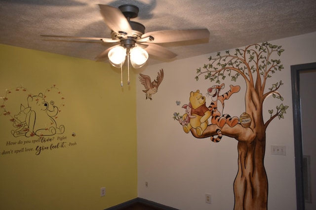 spare room featuring ceiling fan and a textured ceiling