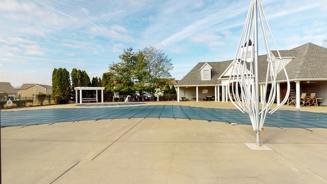 view of swimming pool with a patio