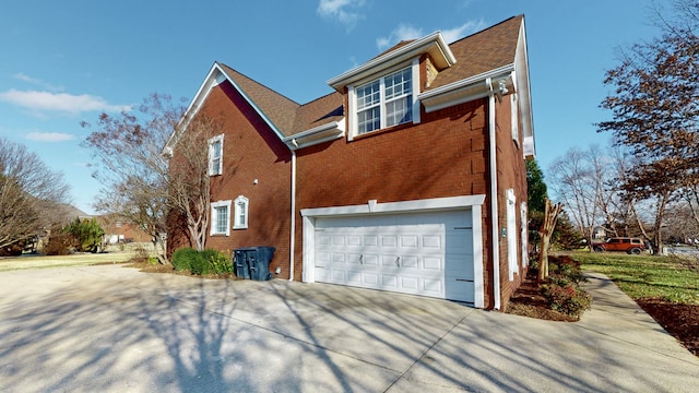 view of side of property with a garage