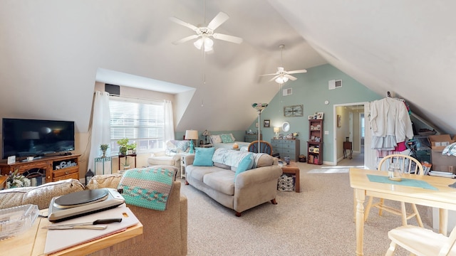 carpeted living room featuring ceiling fan and vaulted ceiling