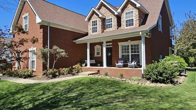 view of front of house with a front lawn and covered porch