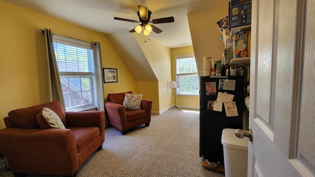 bonus room with ceiling fan, plenty of natural light, light colored carpet, and lofted ceiling