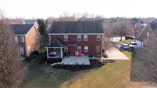 rear view of house with a yard