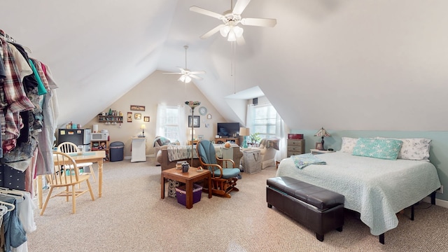 bedroom with ceiling fan, lofted ceiling, and carpet floors