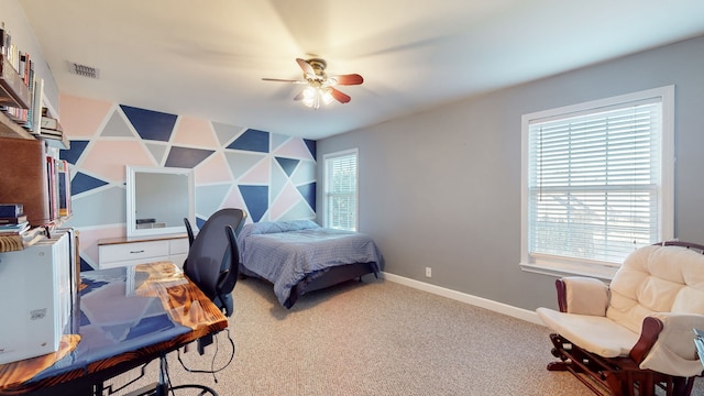 bedroom with ceiling fan and carpet