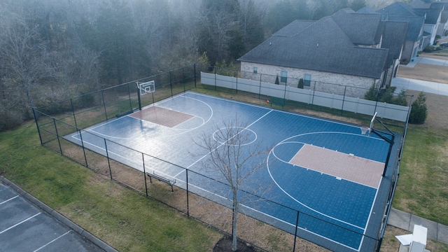 view of basketball court featuring a yard