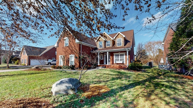 view of property featuring a garage and a front yard