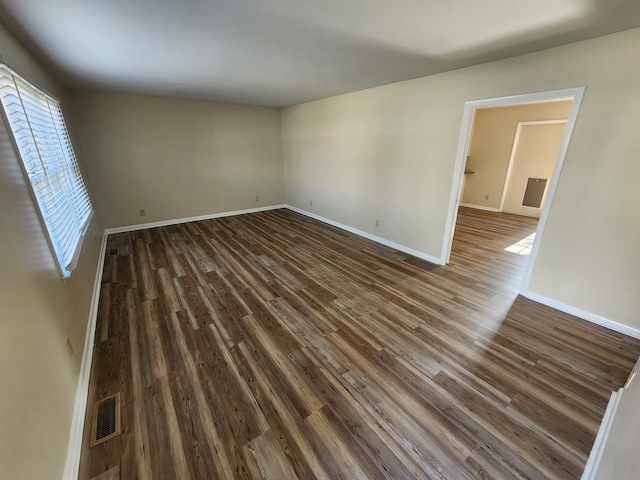 empty room featuring dark hardwood / wood-style floors