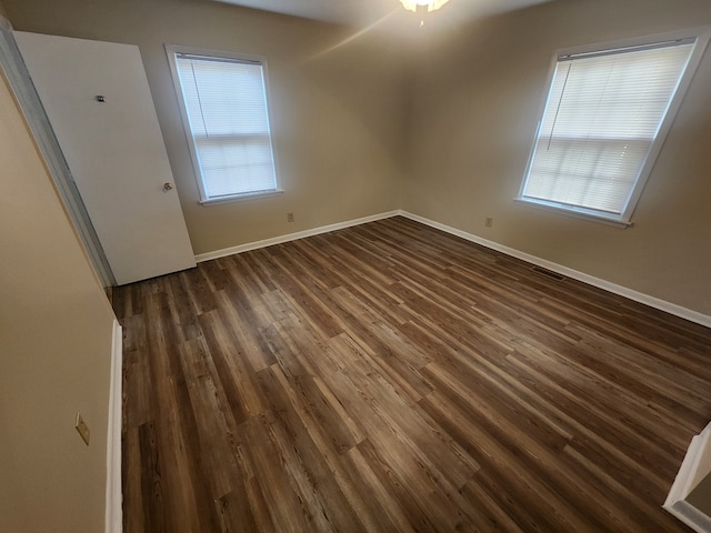 empty room featuring dark hardwood / wood-style floors