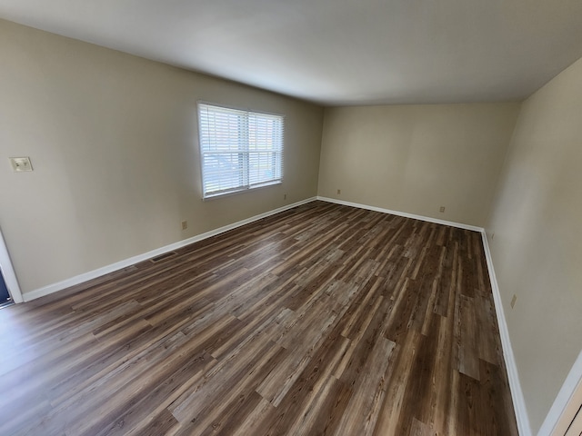 spare room featuring dark hardwood / wood-style floors