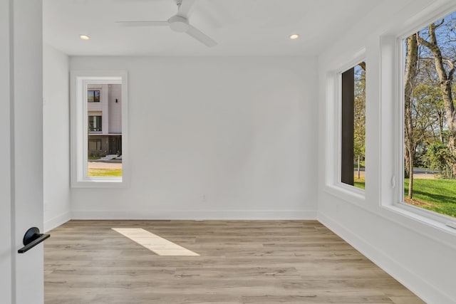 unfurnished room featuring ceiling fan and light hardwood / wood-style floors