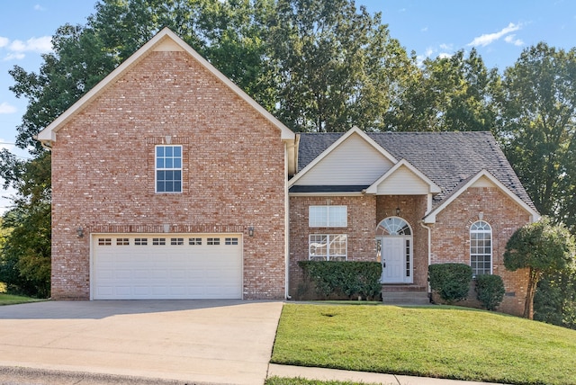 view of property with a front yard and a garage