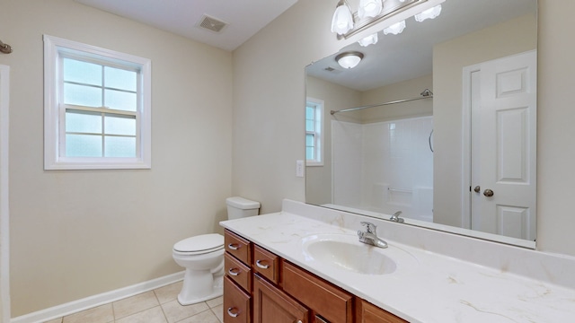 bathroom featuring tile patterned flooring, vanity, and toilet