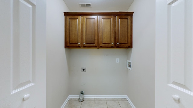 laundry area with cabinets, hookup for a washing machine, light tile patterned floors, and electric dryer hookup