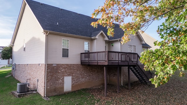 back of property featuring cooling unit and a deck