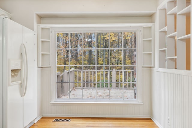 interior space featuring plenty of natural light and light hardwood / wood-style floors