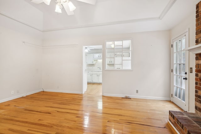 interior space featuring ceiling fan, sink, and light hardwood / wood-style floors