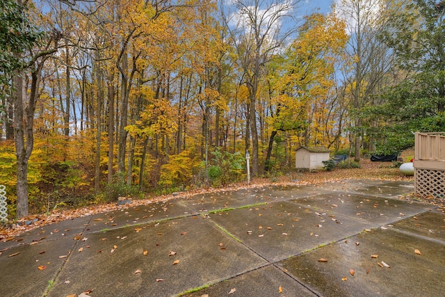 view of patio / terrace featuring a storage unit