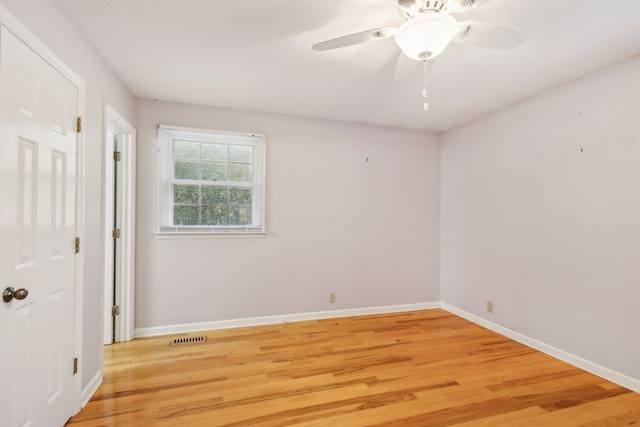 spare room with ceiling fan and light hardwood / wood-style flooring