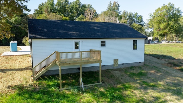 back of house featuring a yard and a deck