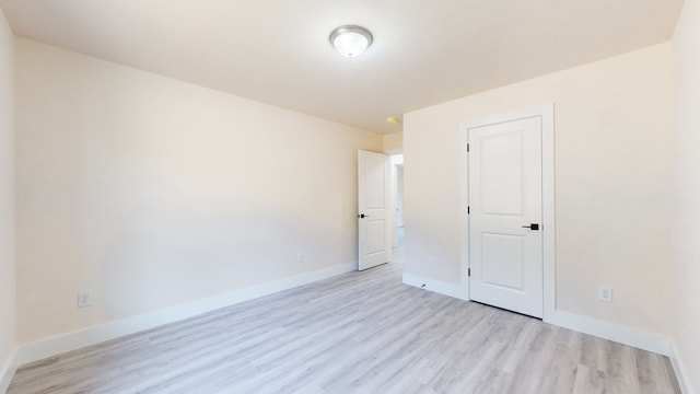 spare room featuring light hardwood / wood-style flooring