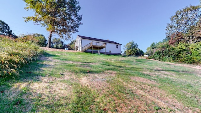 view of yard featuring a wooden deck