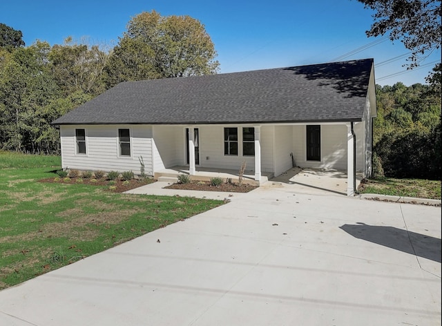 view of front of home featuring covered porch and a front yard