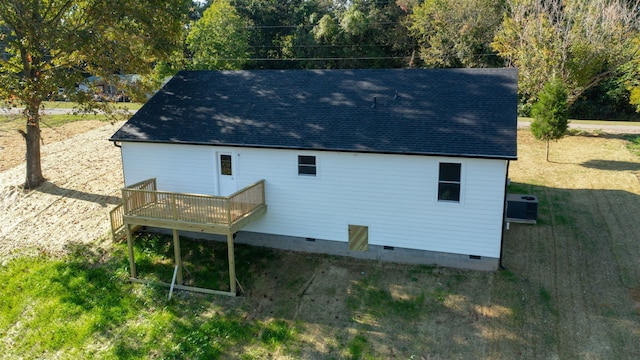 back of house featuring a yard, cooling unit, and a wooden deck