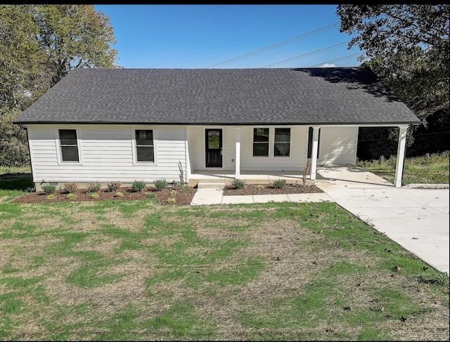 ranch-style home with a carport, a porch, and a front lawn