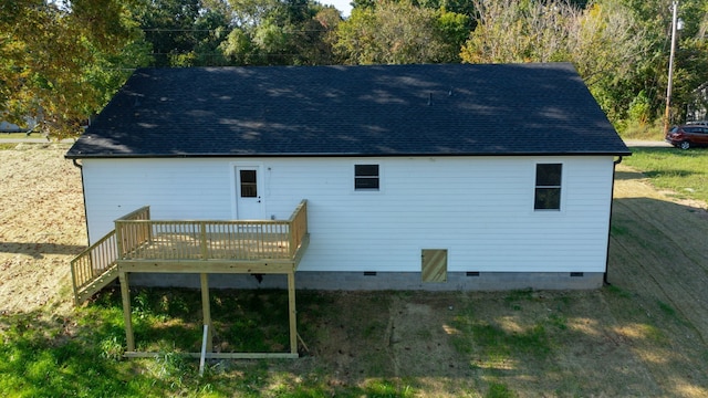 back of house with a yard and a wooden deck