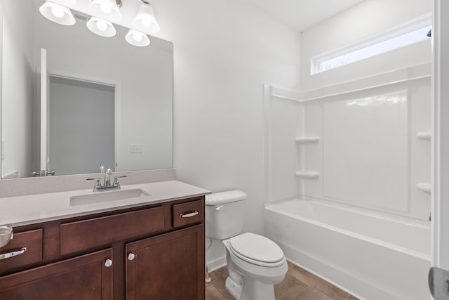 full bathroom with tile patterned floors, vanity, shower / bath combination, and toilet