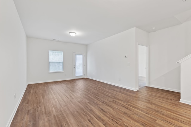 unfurnished room featuring hardwood / wood-style floors