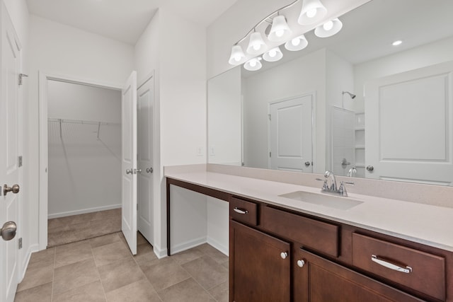 bathroom with vanity, tile patterned floors, and walk in shower