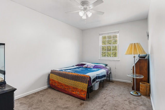 bedroom featuring ceiling fan and carpet