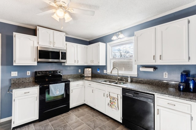 kitchen featuring sink, white cabinets, black appliances, and a textured ceiling