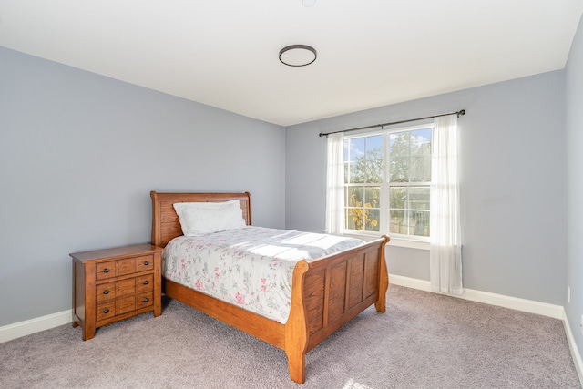 bedroom with light colored carpet