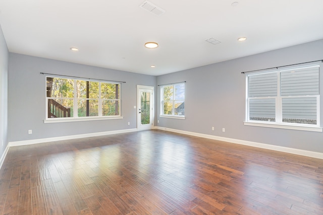 empty room featuring dark wood-type flooring