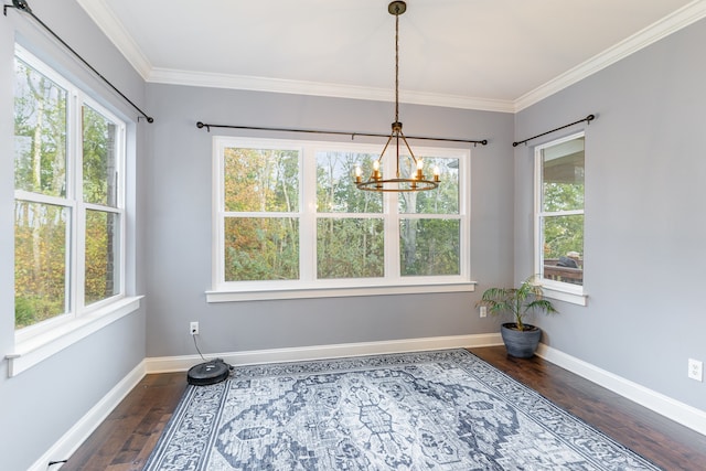 dining space featuring a wealth of natural light, dark hardwood / wood-style flooring, and crown molding