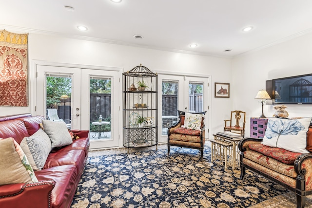 carpeted living room featuring french doors and ornamental molding