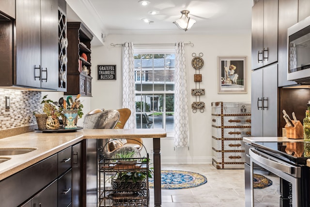 kitchen with dark brown cabinetry, decorative backsplash, stainless steel appliances, and ornamental molding