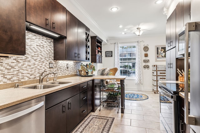 kitchen with backsplash, sink, ornamental molding, appliances with stainless steel finishes, and dark brown cabinetry