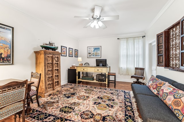 office area featuring wood-type flooring, ceiling fan, and crown molding