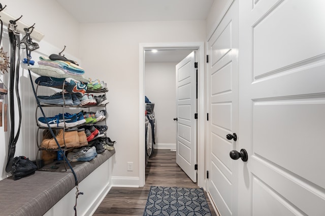 interior space with dark hardwood / wood-style flooring and independent washer and dryer