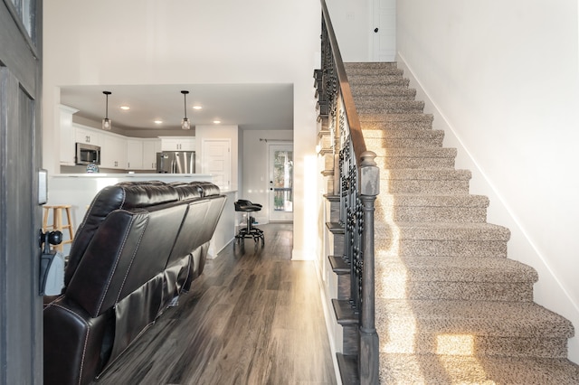 stairway featuring hardwood / wood-style flooring