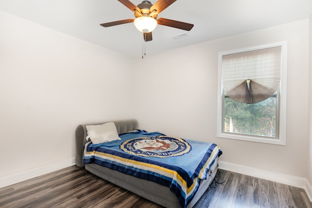 bedroom featuring dark hardwood / wood-style floors and ceiling fan