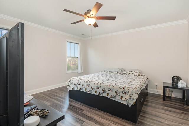 bedroom featuring ceiling fan, crown molding, and dark hardwood / wood-style floors