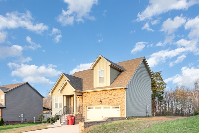 view of front of home featuring a front yard and a garage