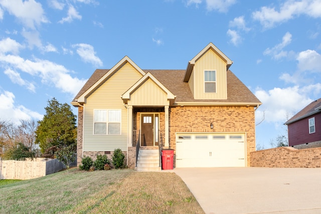 view of front of home with a front yard and a garage